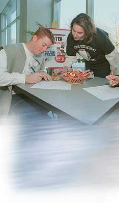 Image of Student filling paperwork