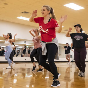 Students in a Zumba group fitness session at the IBC Student Rec Center.  