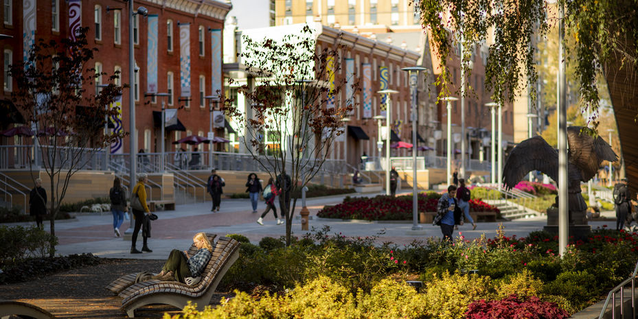 Students walking across Liacouras Walk on a sunny day