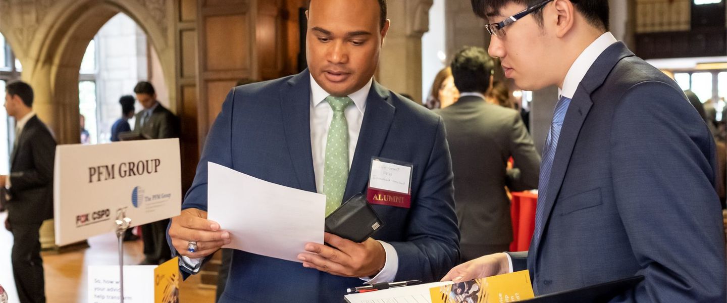 A potential employer peruses the resume of a Fox student.