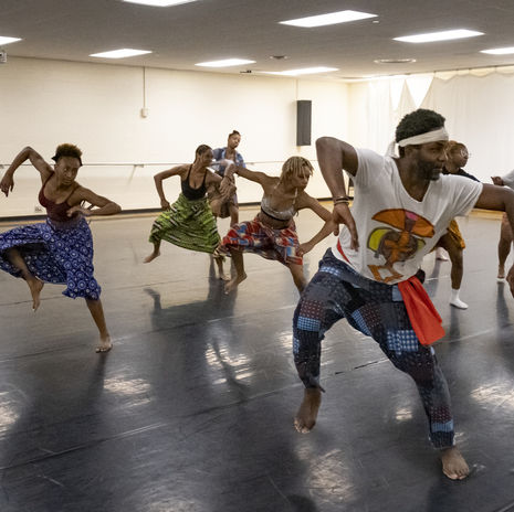students participating in an African dance class.