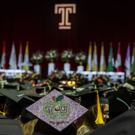 a graduation cap in a crowd of caps