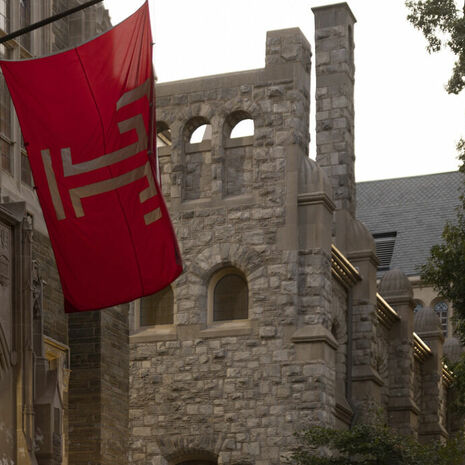 The Temple flag flying outside on Main Campus