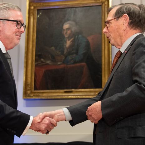 A picture of President John Fry being inducted into the American Philosophical Society.