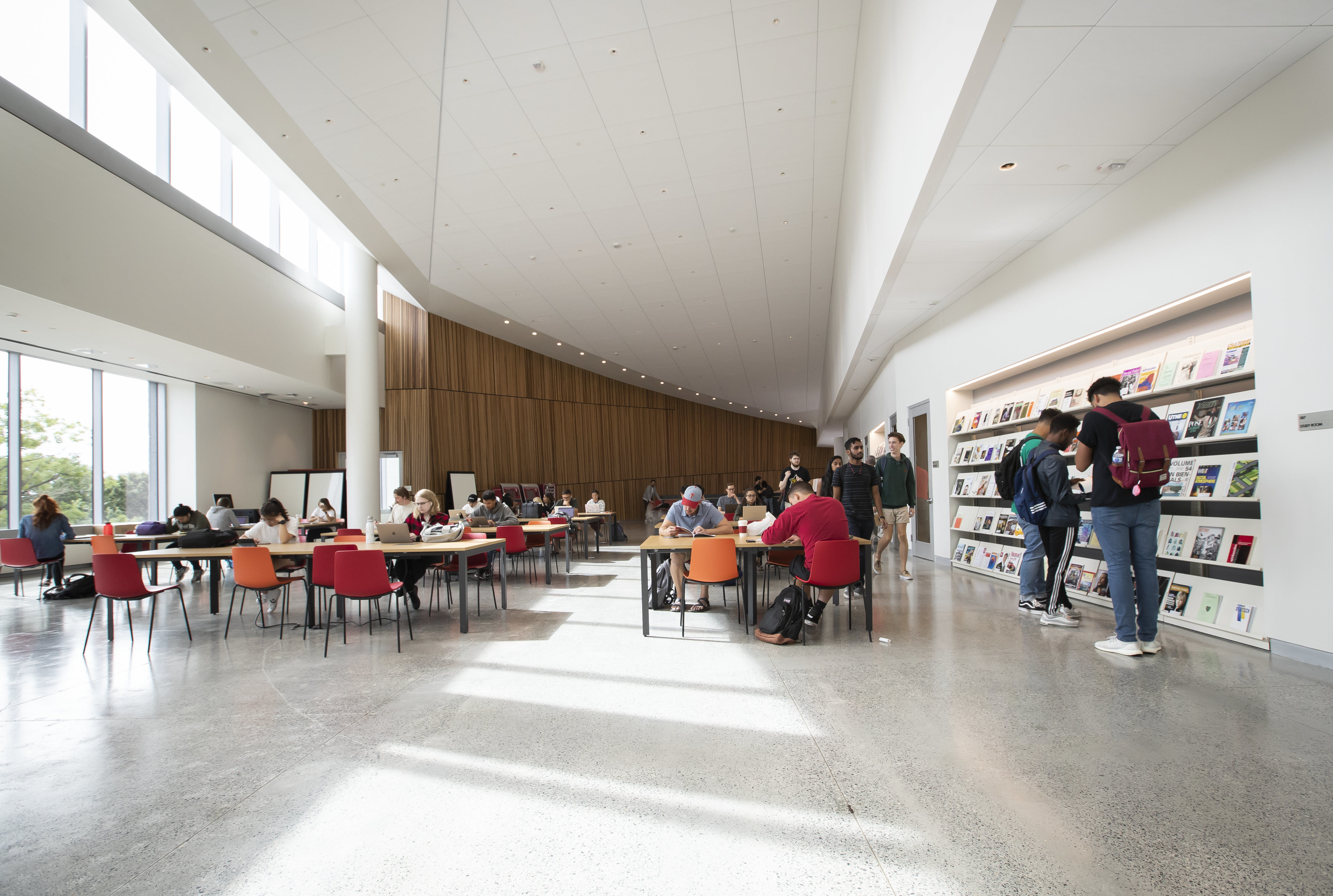 students studying and browsing periodicals in Charles Library