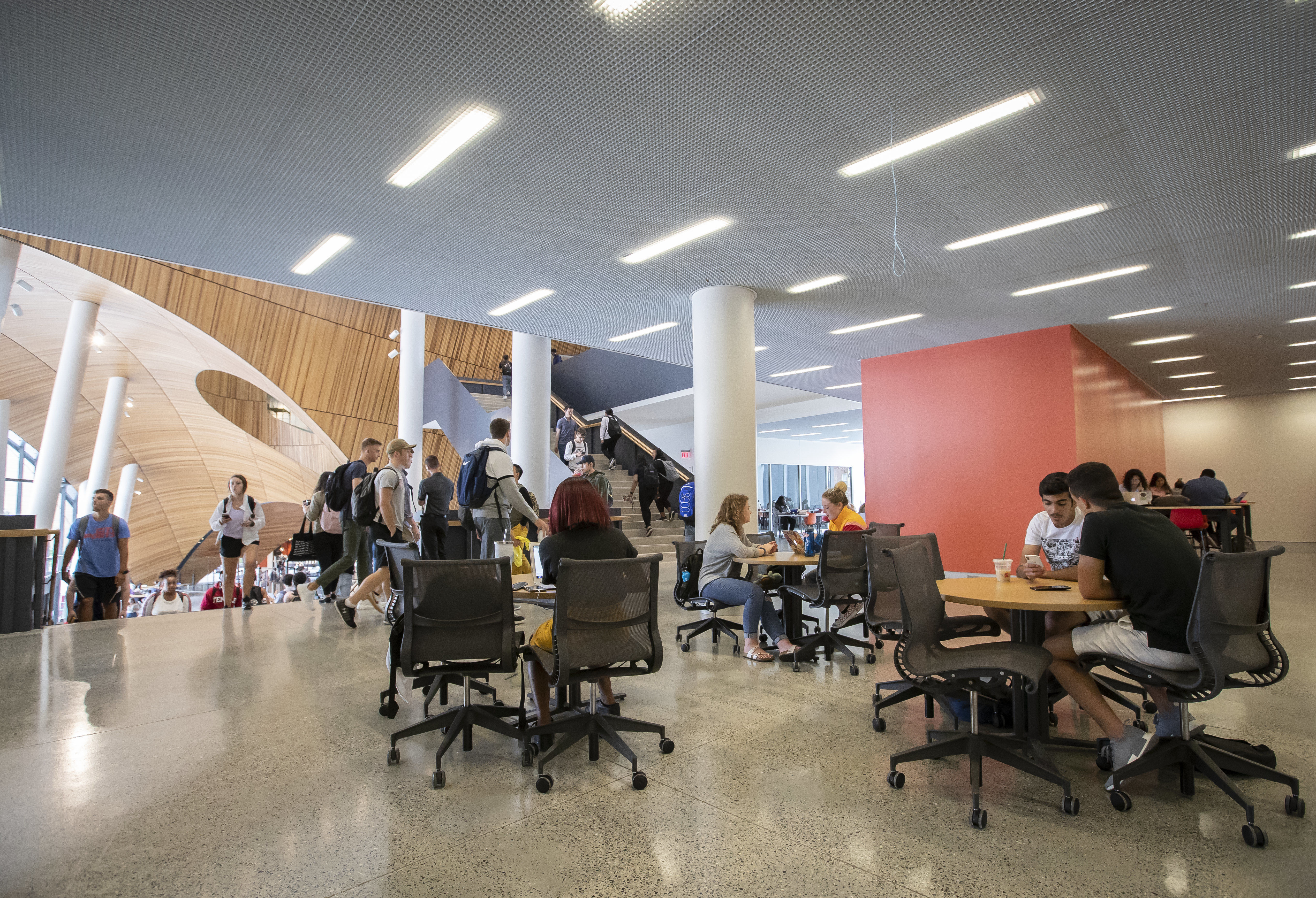 students studying at tables on the second floor of Charles Library