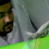 Engineering student conducting experiment in a lab