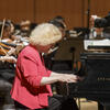 Sara Davis Buechner plays piano with a large ensemble.