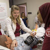 nursing students participate in a simulation. 
