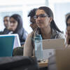 Several students listening in a Temple University Center City campus classroom.
