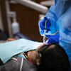 A patient in the Kornberg School of Dentistry receiving periodontics work. 