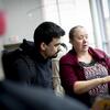 A Temple student discusses a research plan with a faculty member.