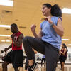 Male and female student in group fitness session