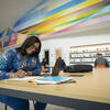 an adult student focuses on her coursework. 