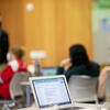 An image of students working on projects in class