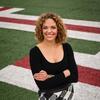 a professional photo of breland moore standing on a playing field