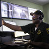 one of Temple's security staff checking safety camera footage.