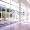 A sunny hallway in the Tyler building displaying student illustrations