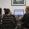 Public health students in a language lab with professor