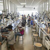 An image of students creating jewelry in the classroom