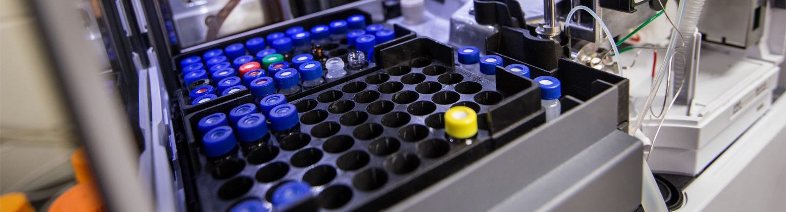 A series of test tubes in a machine at a research lab in the College of Science and Technology at Temple.