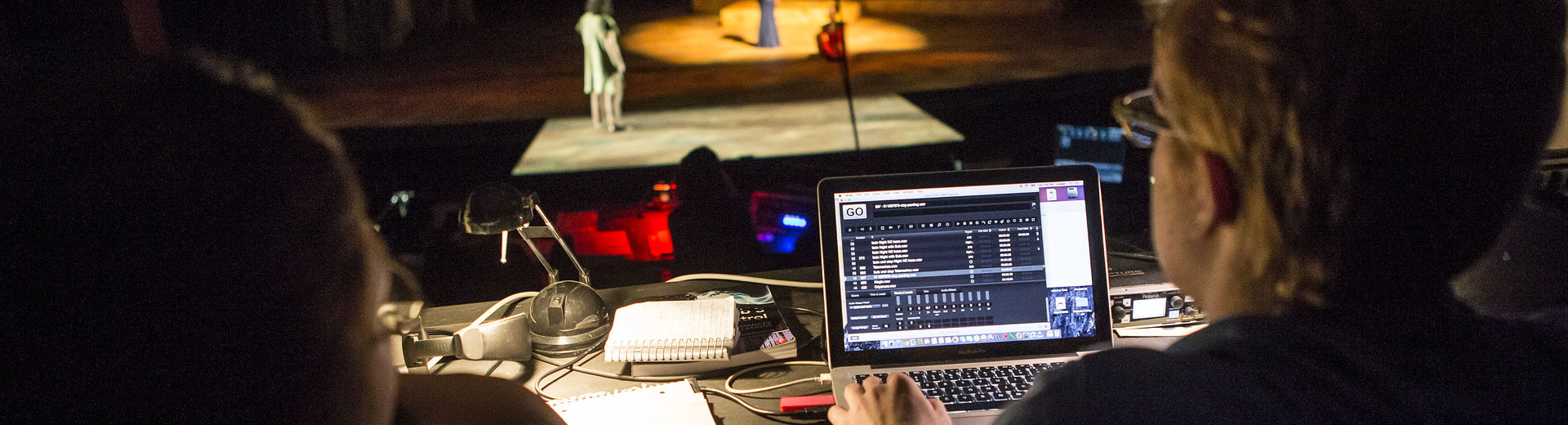 Director overseeing a theater rehearsal.