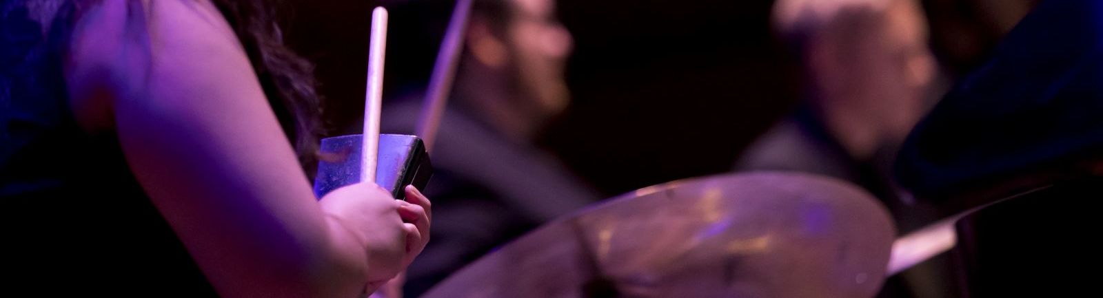 Women playing percussion.