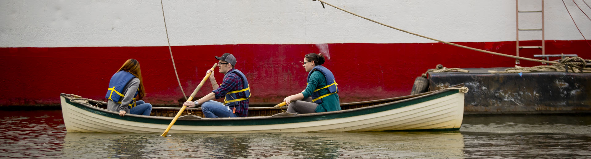 Temple graduate students in the Material Cultures class in a boat at the seaport museum