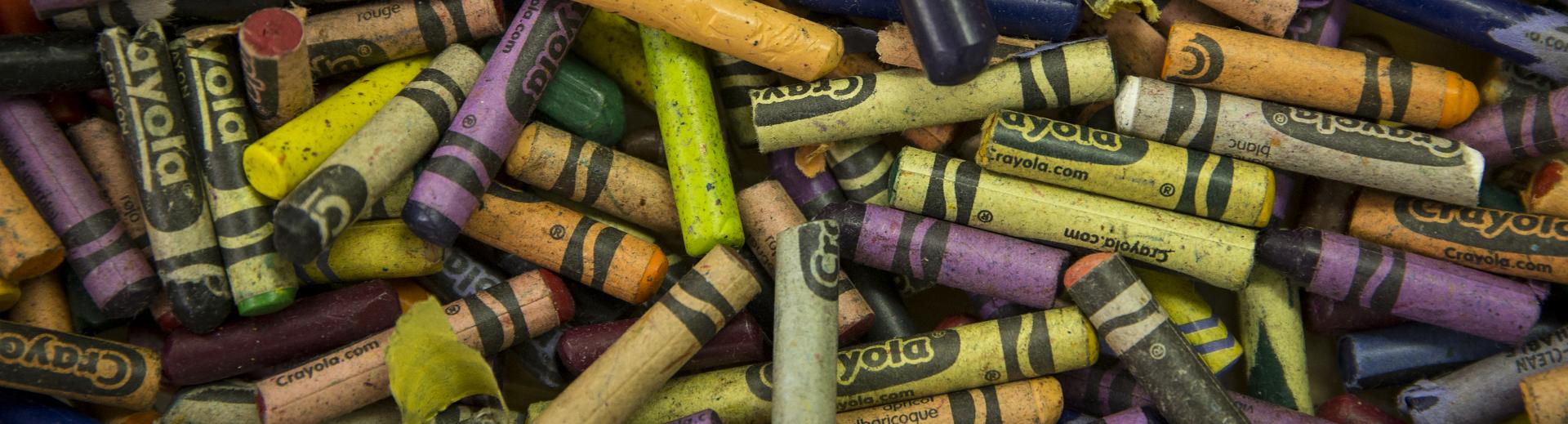 pile of crayons in a classroom