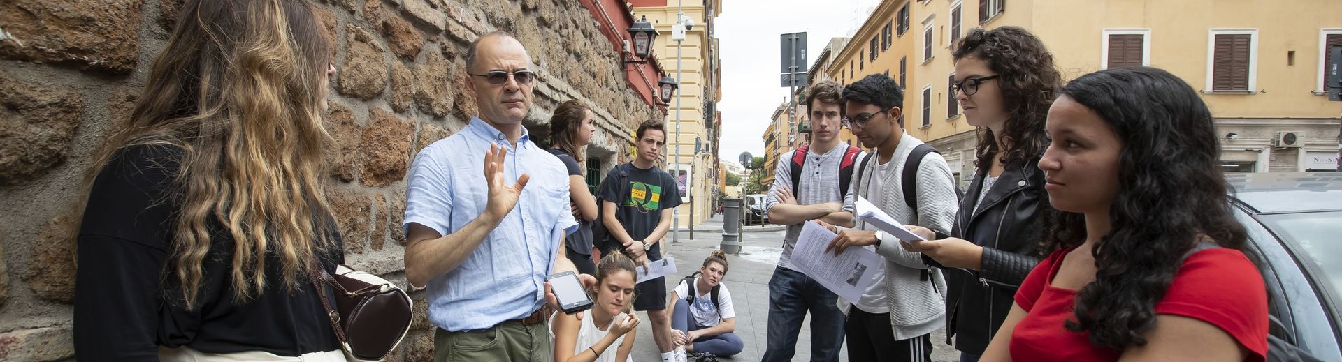 A Temple professor addresses students during a study away program in Rome.