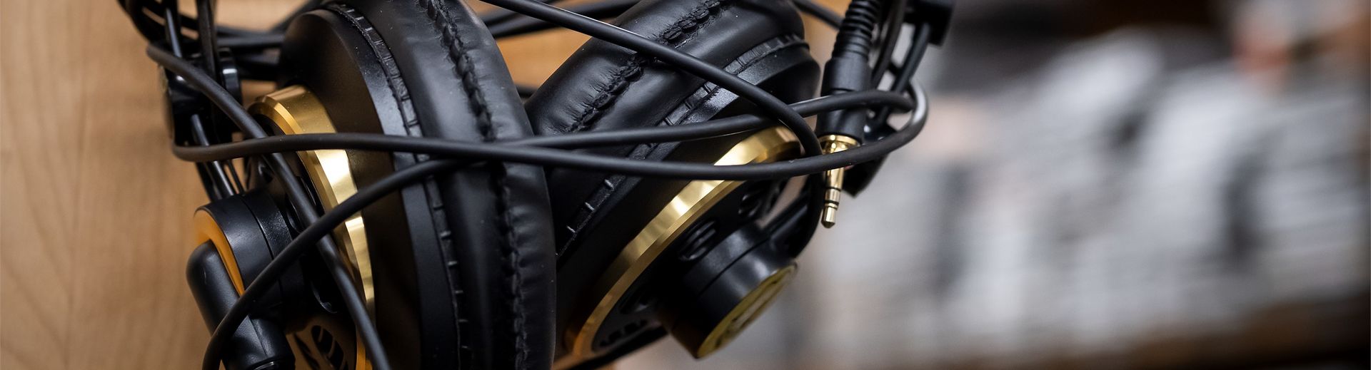 A pair of headphones hangs on a hook.