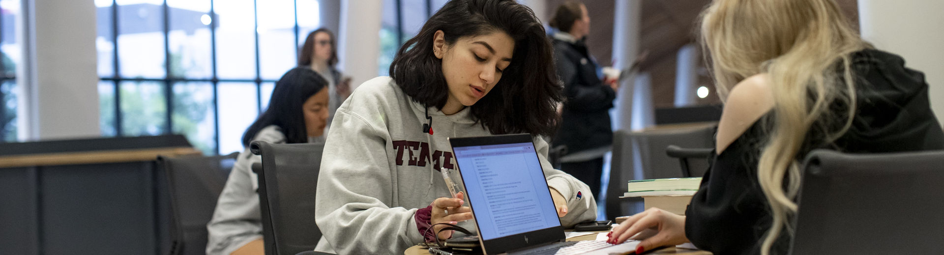 students studying in Charles Library. 