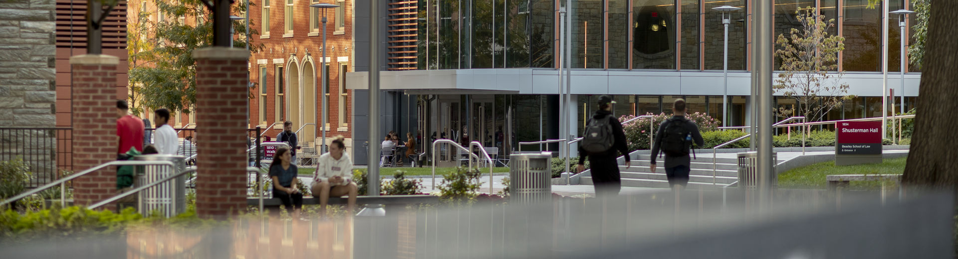 Students gather in O'Connor Plaza on a sunny day.