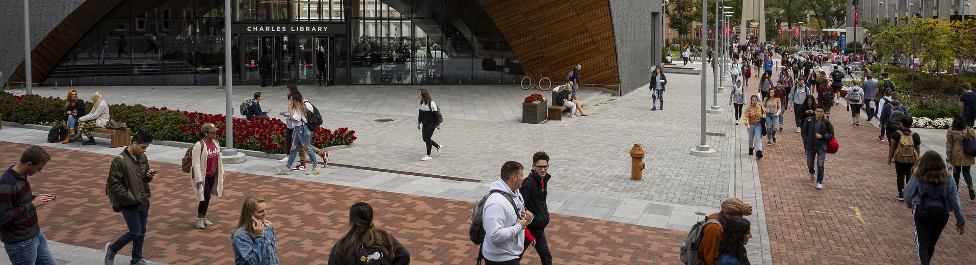 Students walk outside Charles Library on Main Campus