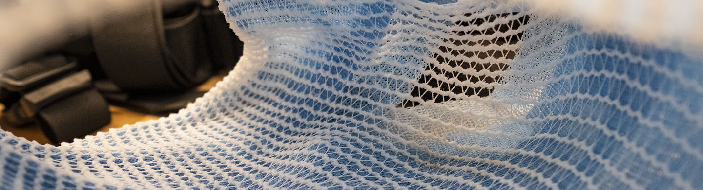 A white plastic netting material used in the development of animal prosthetics.