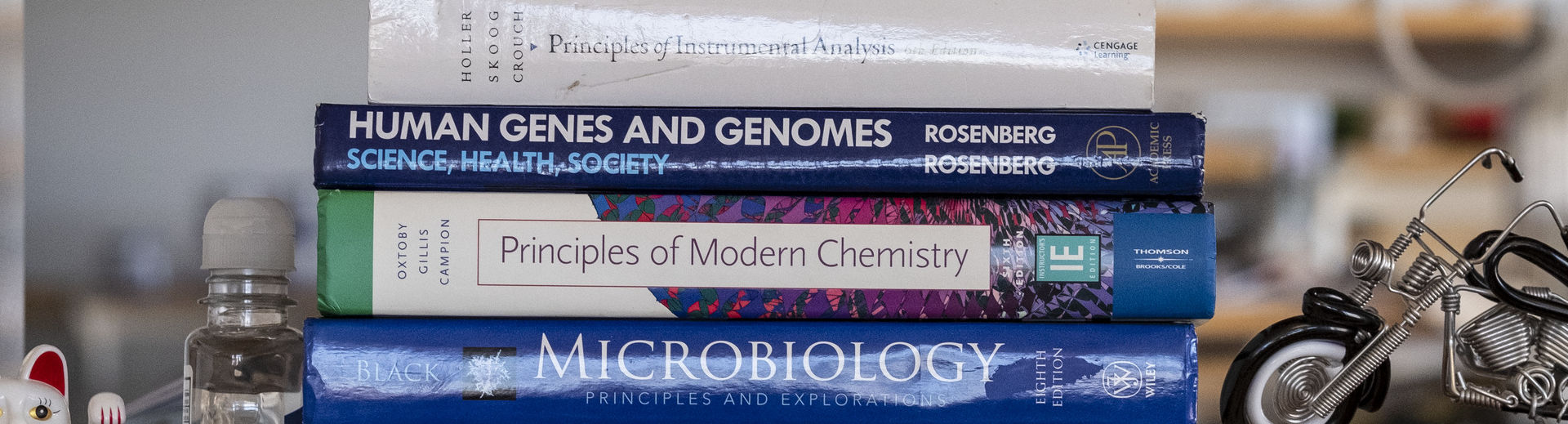 chemistry books on a floating shelf.