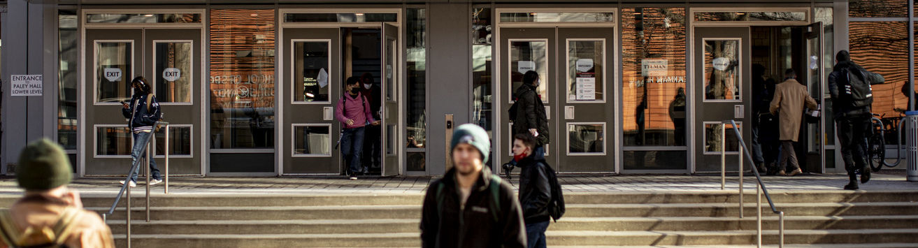 Temple students leaving the Tuttleman Learning Center on Main Campus.