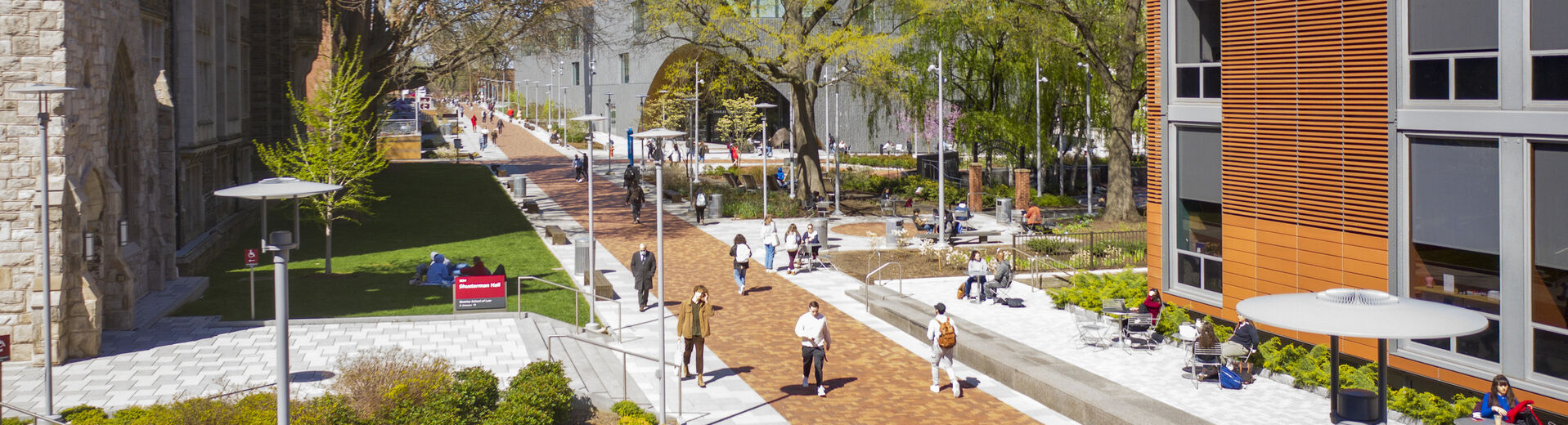 students walking on Temple's Main Campus on a sunny day