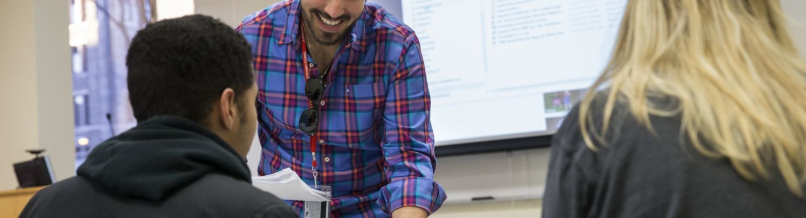 A College of Public Health professor provides personal instruction to students.