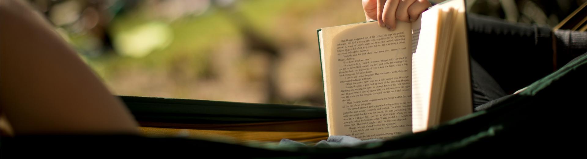 student reading in a hammock 