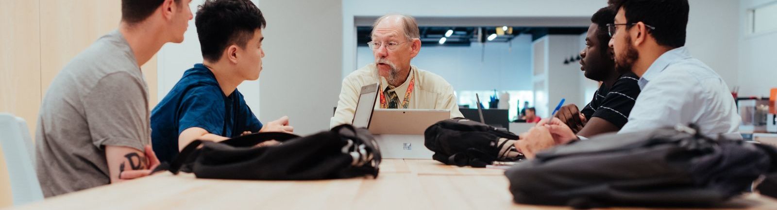 An Engineering Management professor addresses a cohort of students.