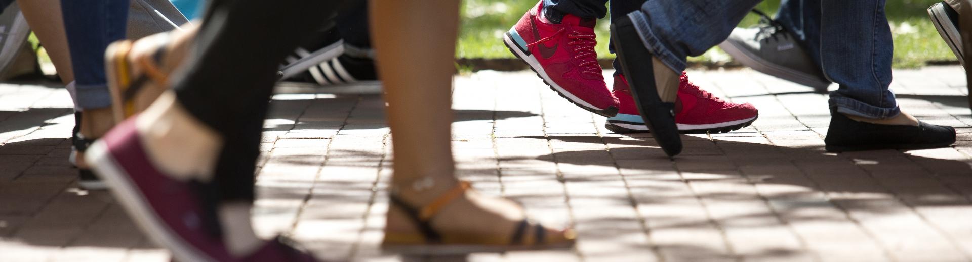 students walking on campus on a spring day