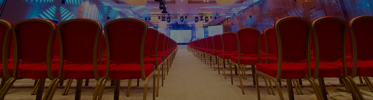 An event space filled with rows of empty chairs.