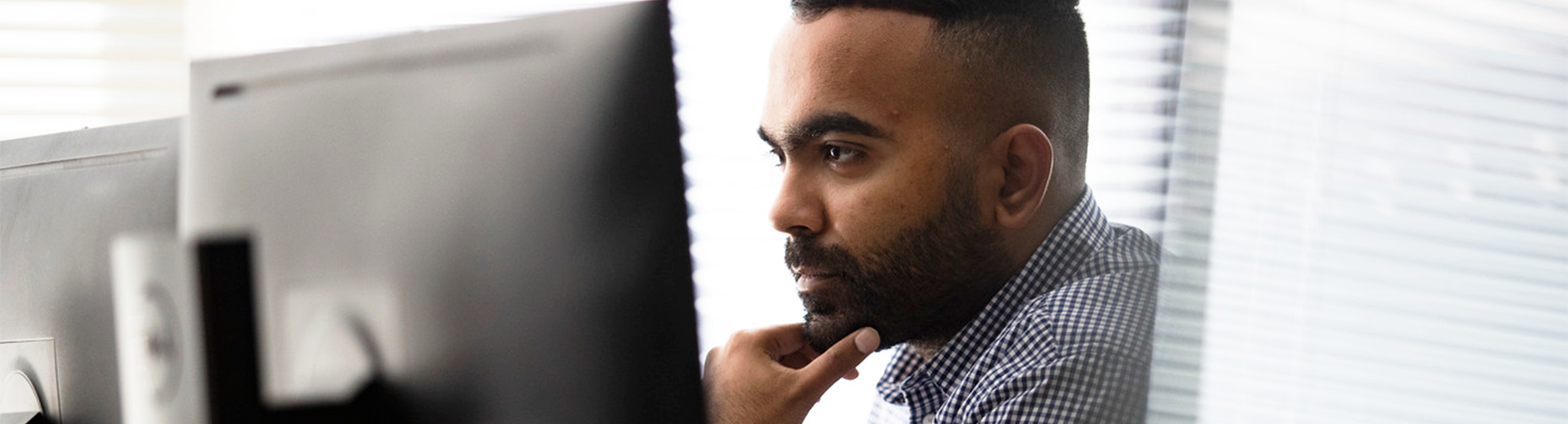 student looking at a computer