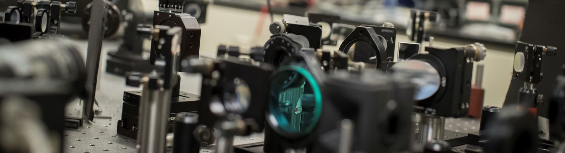 Physics student using instrument for research in a Temple lab. 