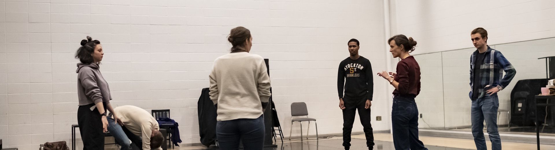 A group of students discuss a scene from the play, "Somewhere."