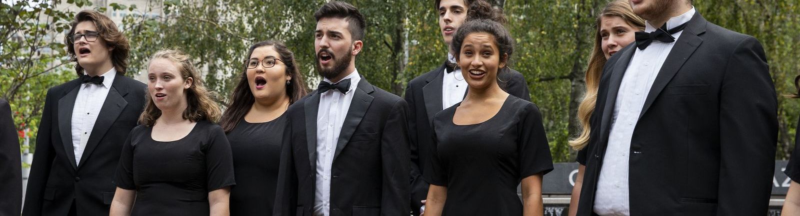 Temple's Boyer College of Music and Dance Concert Choir singing in a performance outdoors.