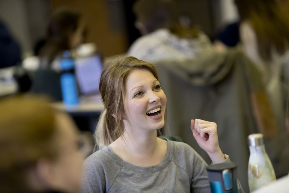 An occupational therapy student laughs during class.