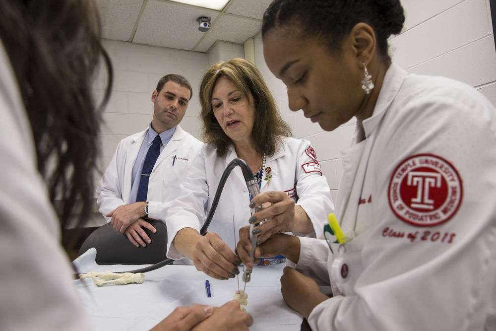 Podiatric students practice new skills under faculty guidance.