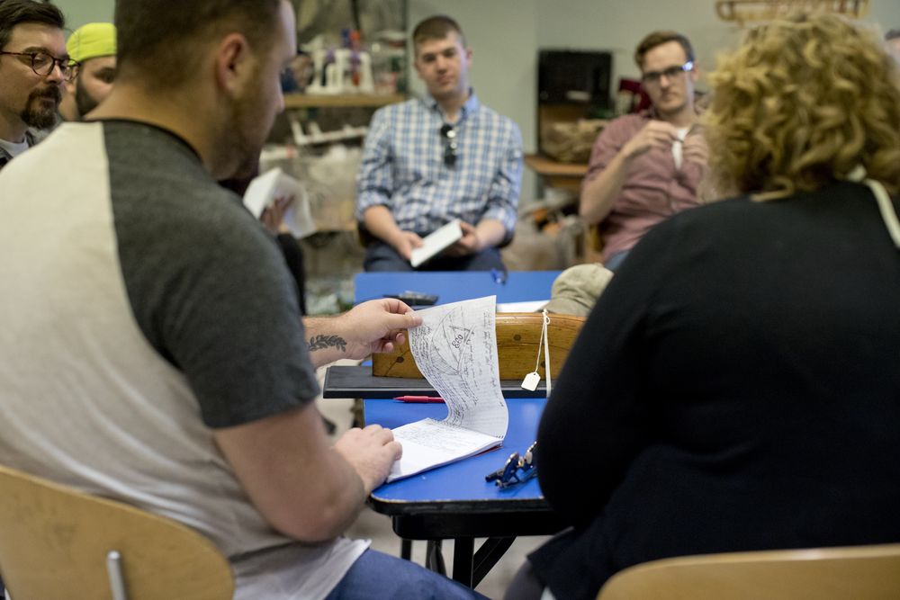 History graduate students participating in hands-on learning in the classroom.